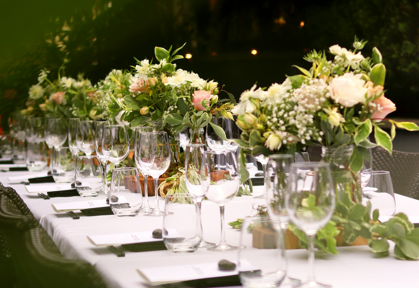 Elegant candlelit wedding reception table with floral runners